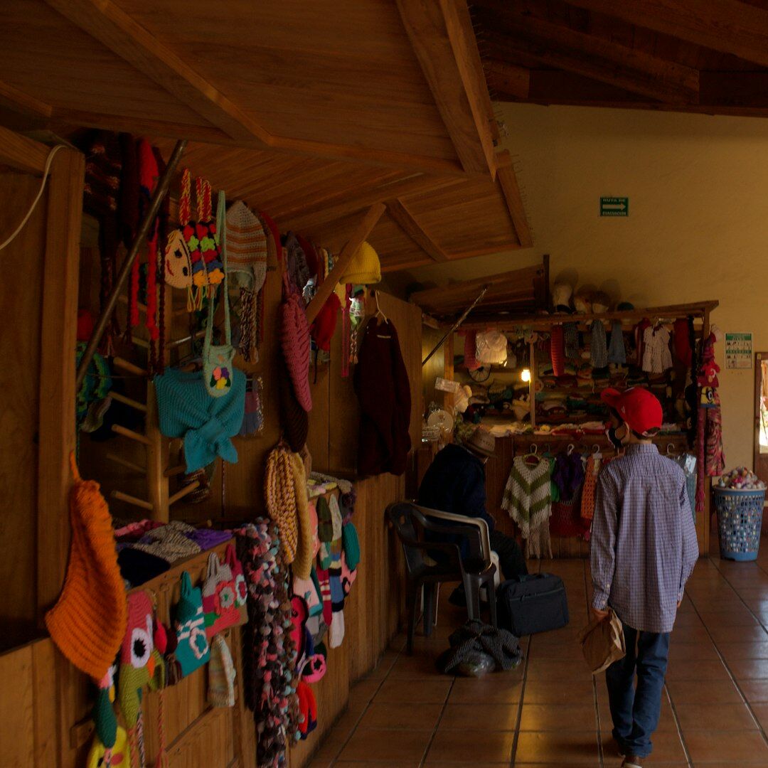 Elderly Mapuche woman selling handmade crafts at a market
