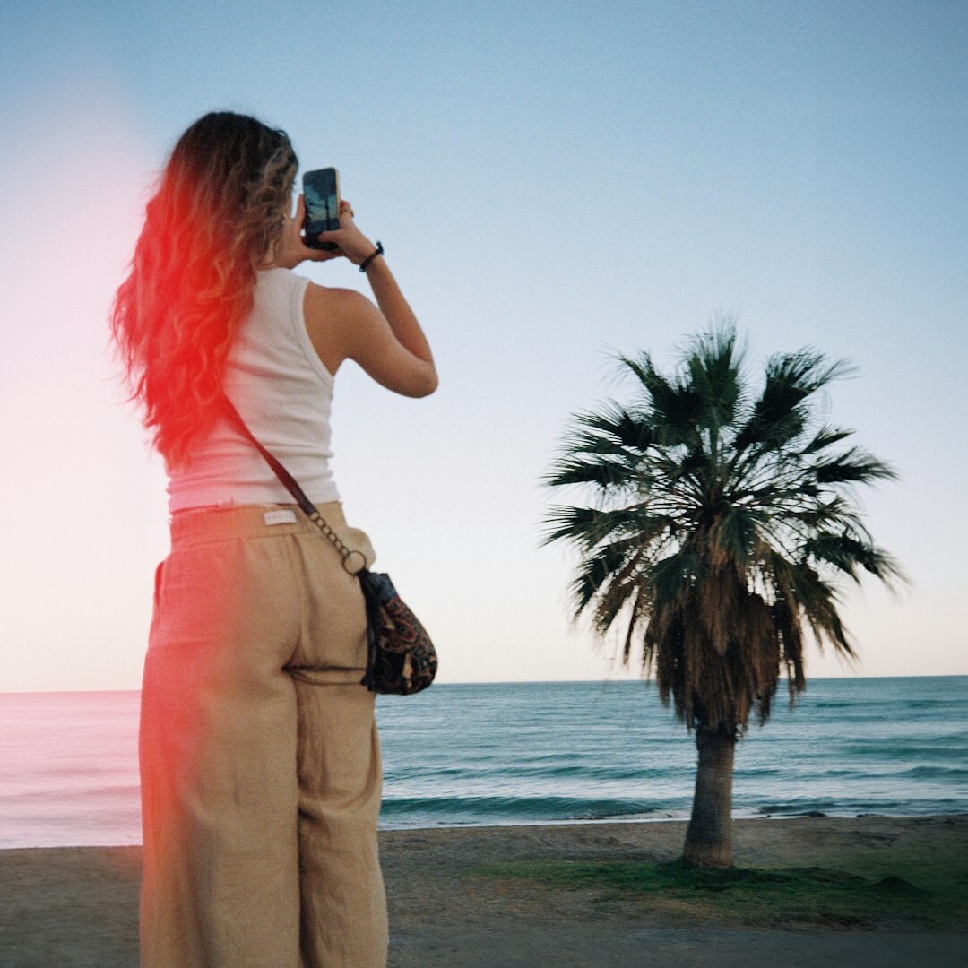 Chilean documentary photographer reviewing photos in the field